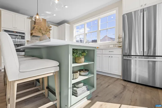 a kitchen with a sink and a refrigerator