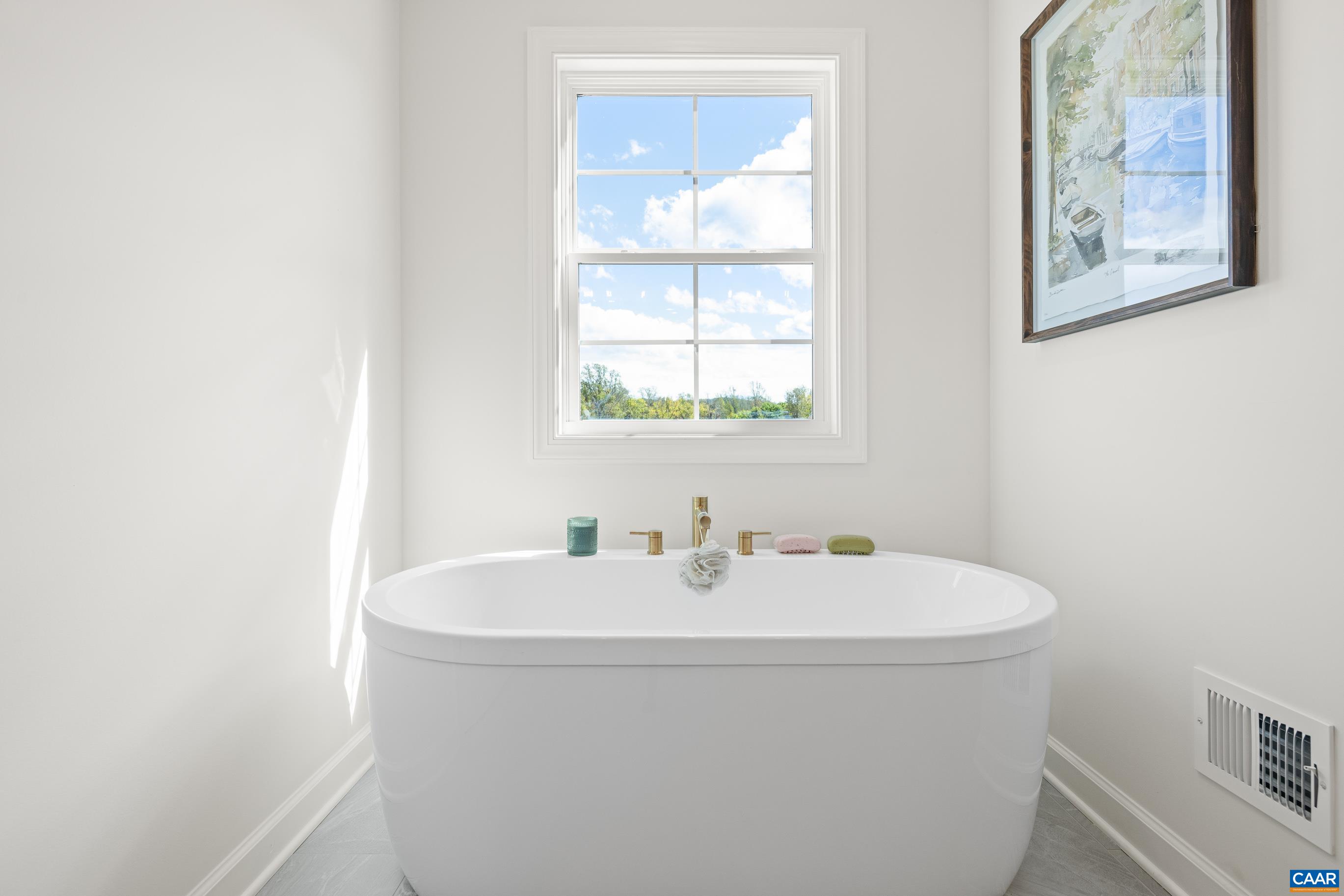 34 F Fowler Street Charlottesville, VA 22901 - Photo 26 of 68 a white bath tub sitting next to a white sink