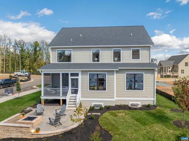 a aerial view of a house with a yard