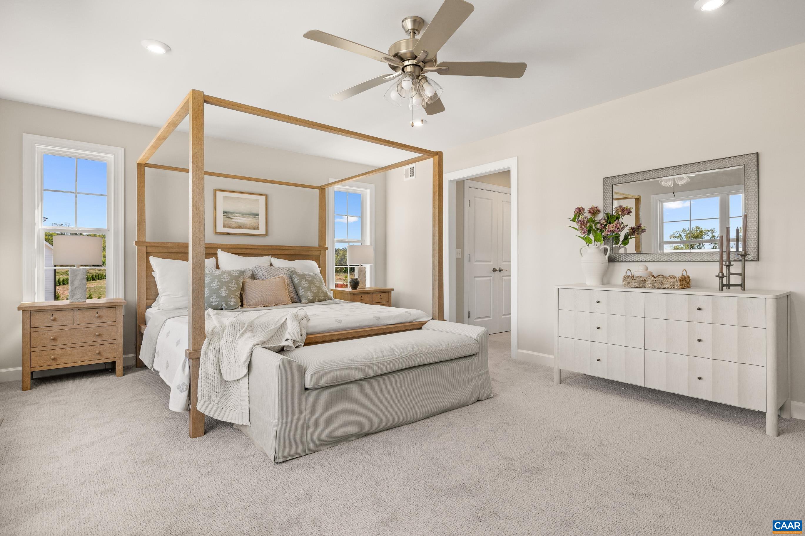 34 F Fowler Street Charlottesville, VA 22901 - Photo 35 of 68 a bed room with a bed and a chandelier