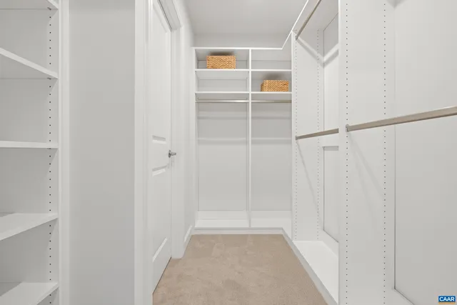 a bedroom with a bed and a lamp