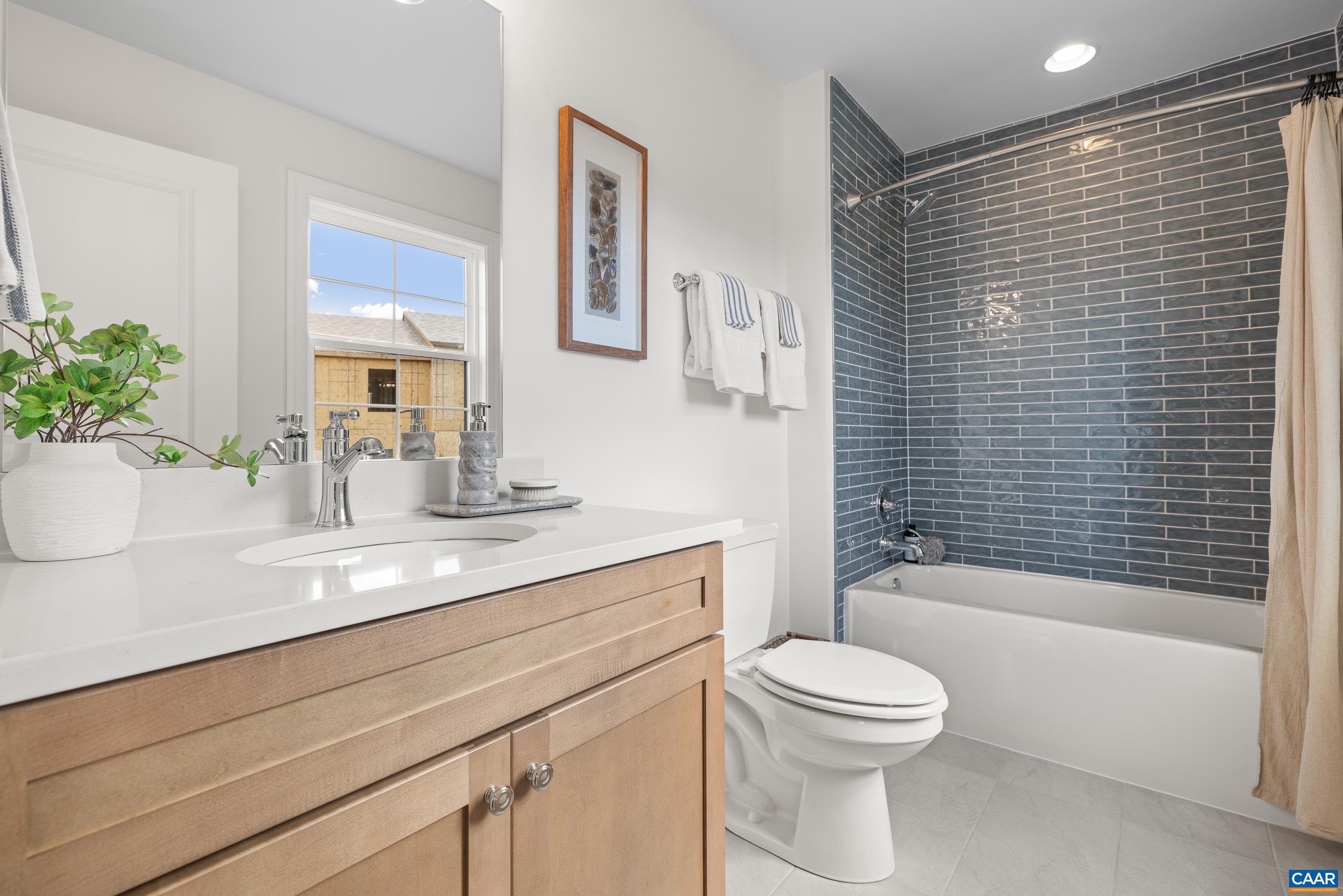 34 F Fowler Street Charlottesville, VA 22901 - Photo 41 of 68 a bathroom with a sink a toilet and shower