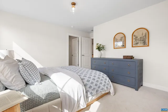 a living room with furniture a fireplace and potted plants