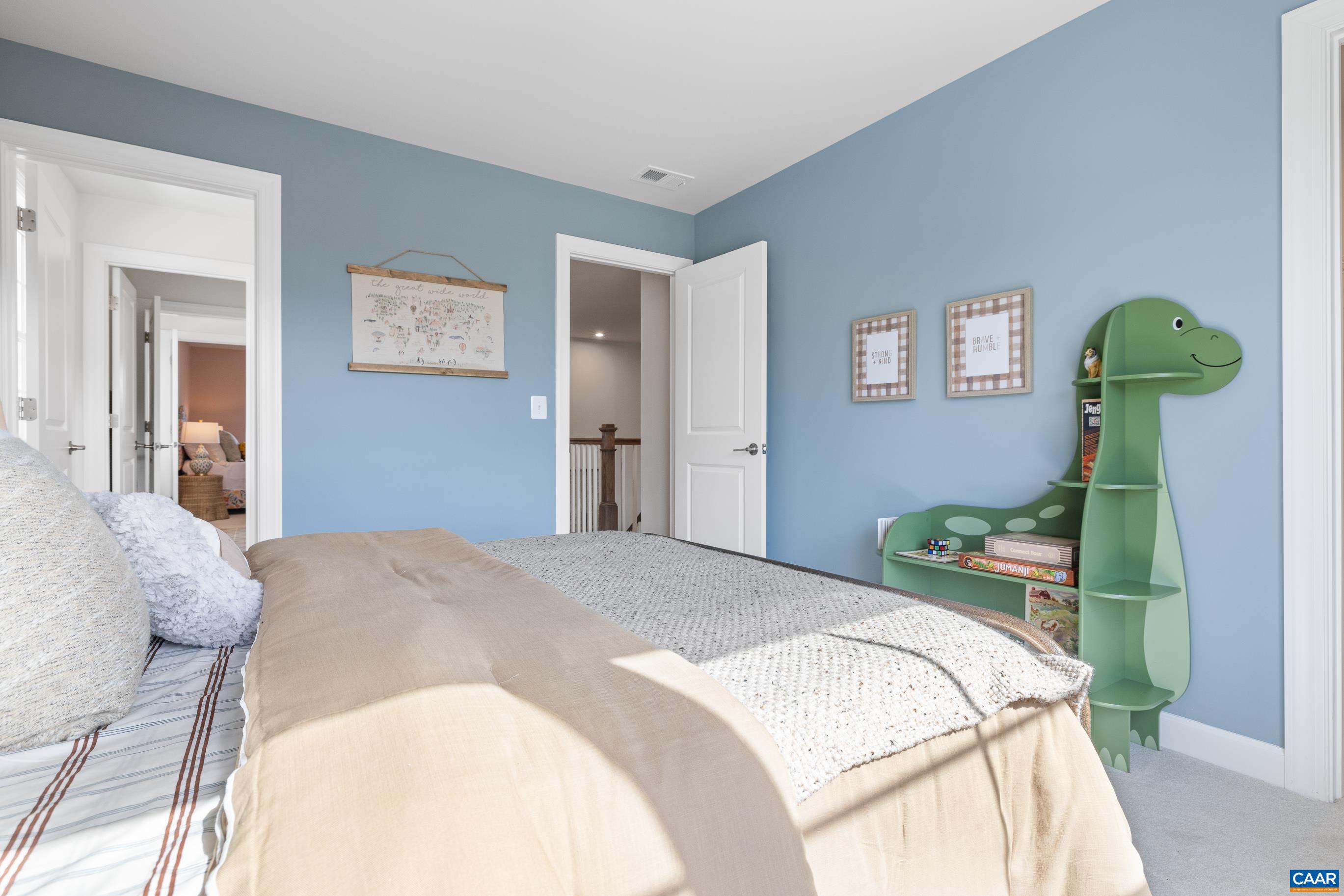 34 F Fowler Street Charlottesville, VA 22901 - Photo 45 of 68 a bedroom with a bed and a painting on the wall