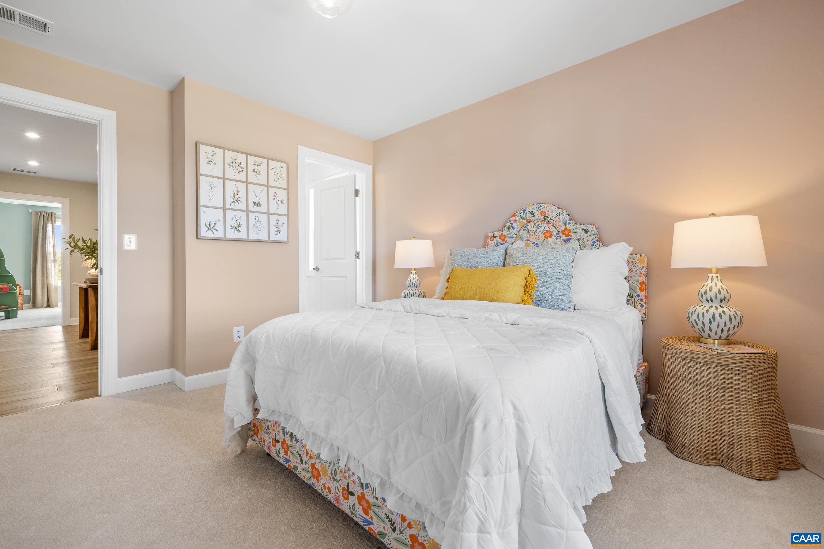 34 F Fowler Street Charlottesville, VA 22901 - Photo 47 of 68 a bedroom with a bed and a lamp