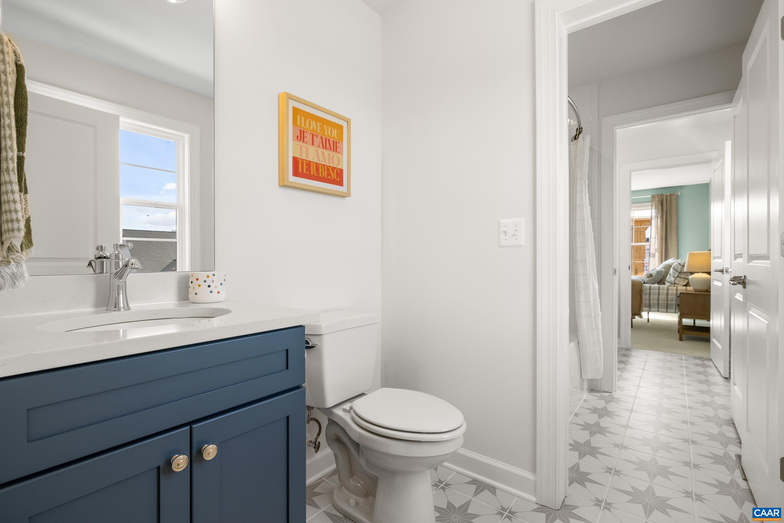 34 F Fowler Street Charlottesville, VA 22901 - Photo 48 of 68 a bathroom with a sink a toilet and a mirror