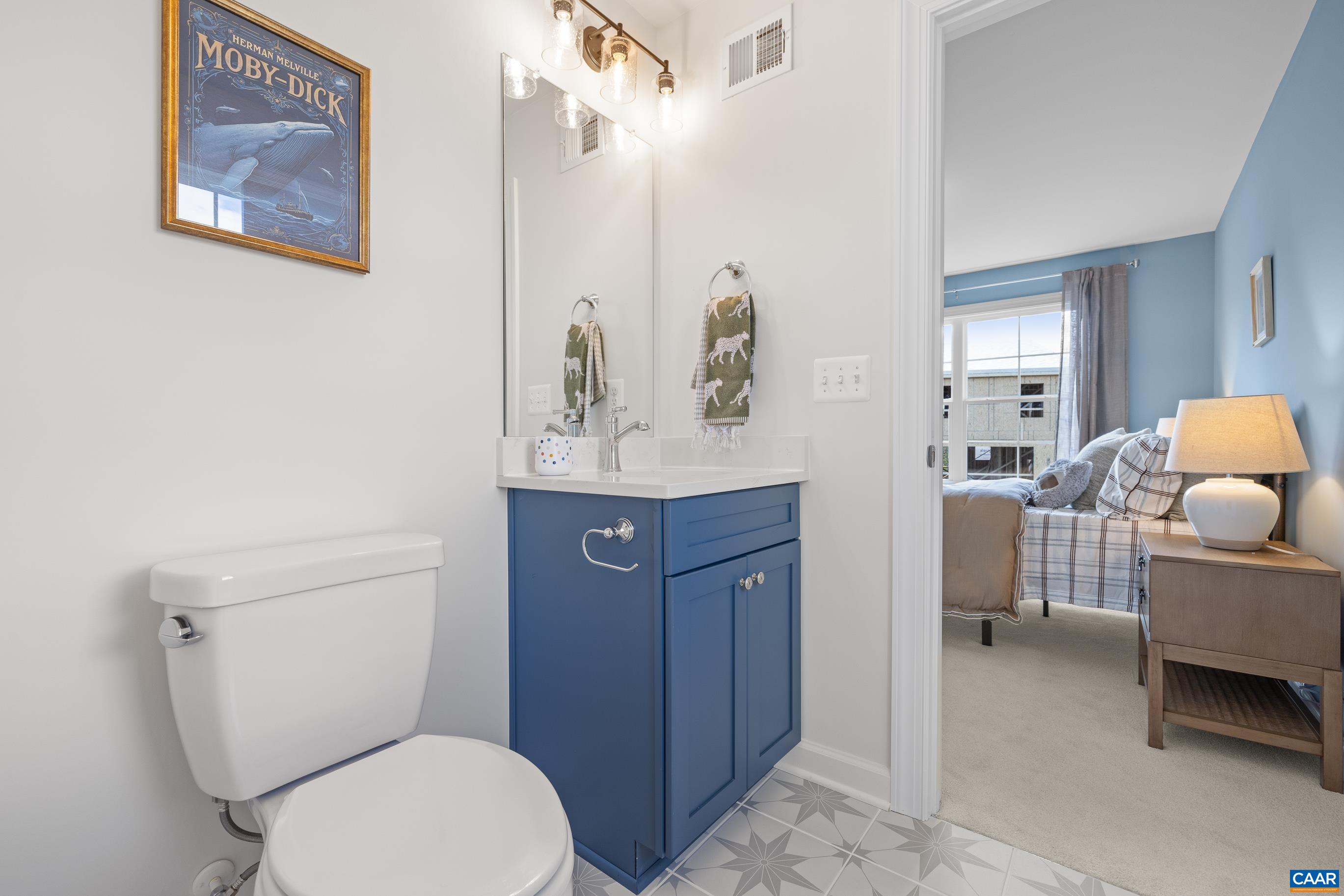 34 F Fowler Street Charlottesville, VA 22901 - Photo 49 of 68 a bathroom with a toilet a sink and a mirror