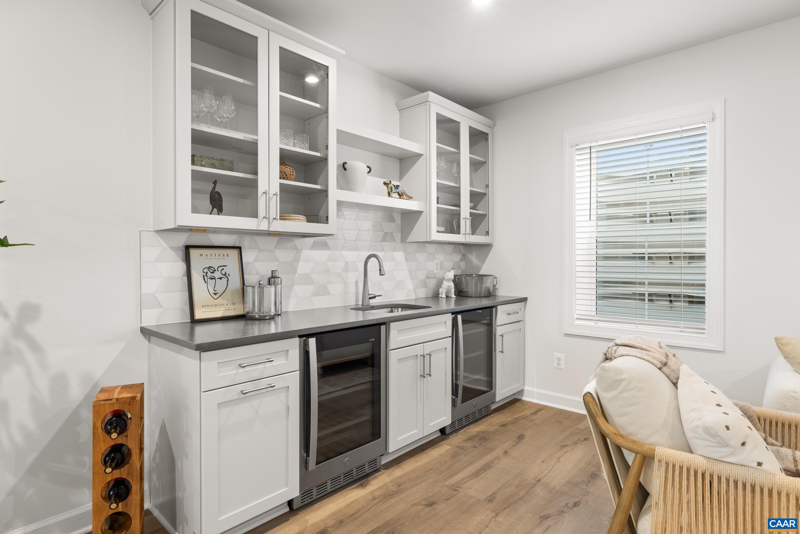 34 F Fowler Street Charlottesville, VA 22901 - Photo 54 of 68 a kitchen with a stove a sink and cabinets