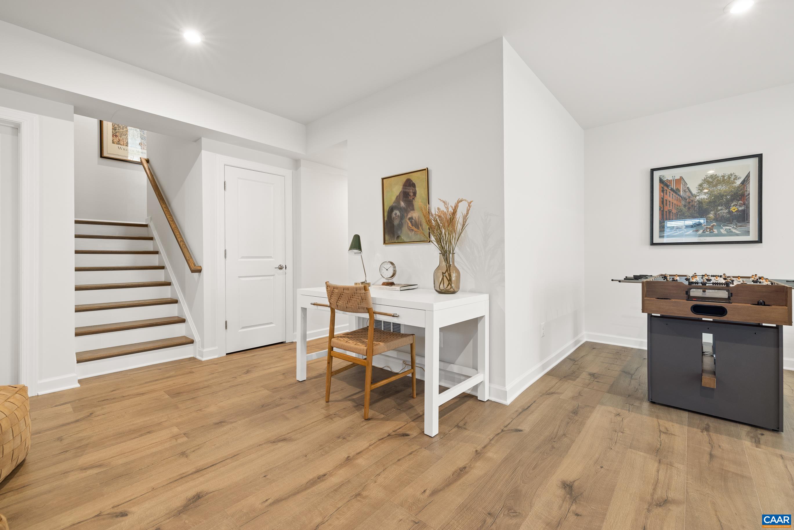 34 F Fowler Street Charlottesville, VA 22901 - Photo 55 of 68 a view of a workspace with furniture and wooden floor