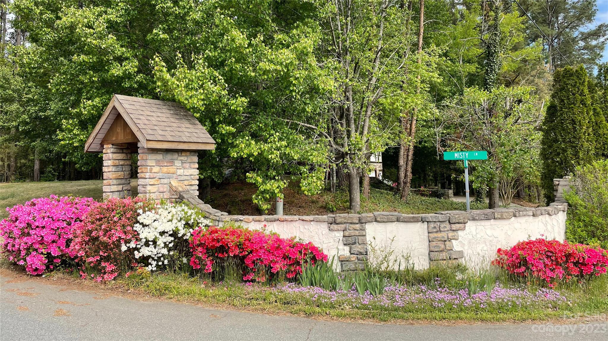 1341 Misty Lane, Unit 9 Hickory, NC 28601 - Photo 3 of 17 a view of a backyard with potted plants