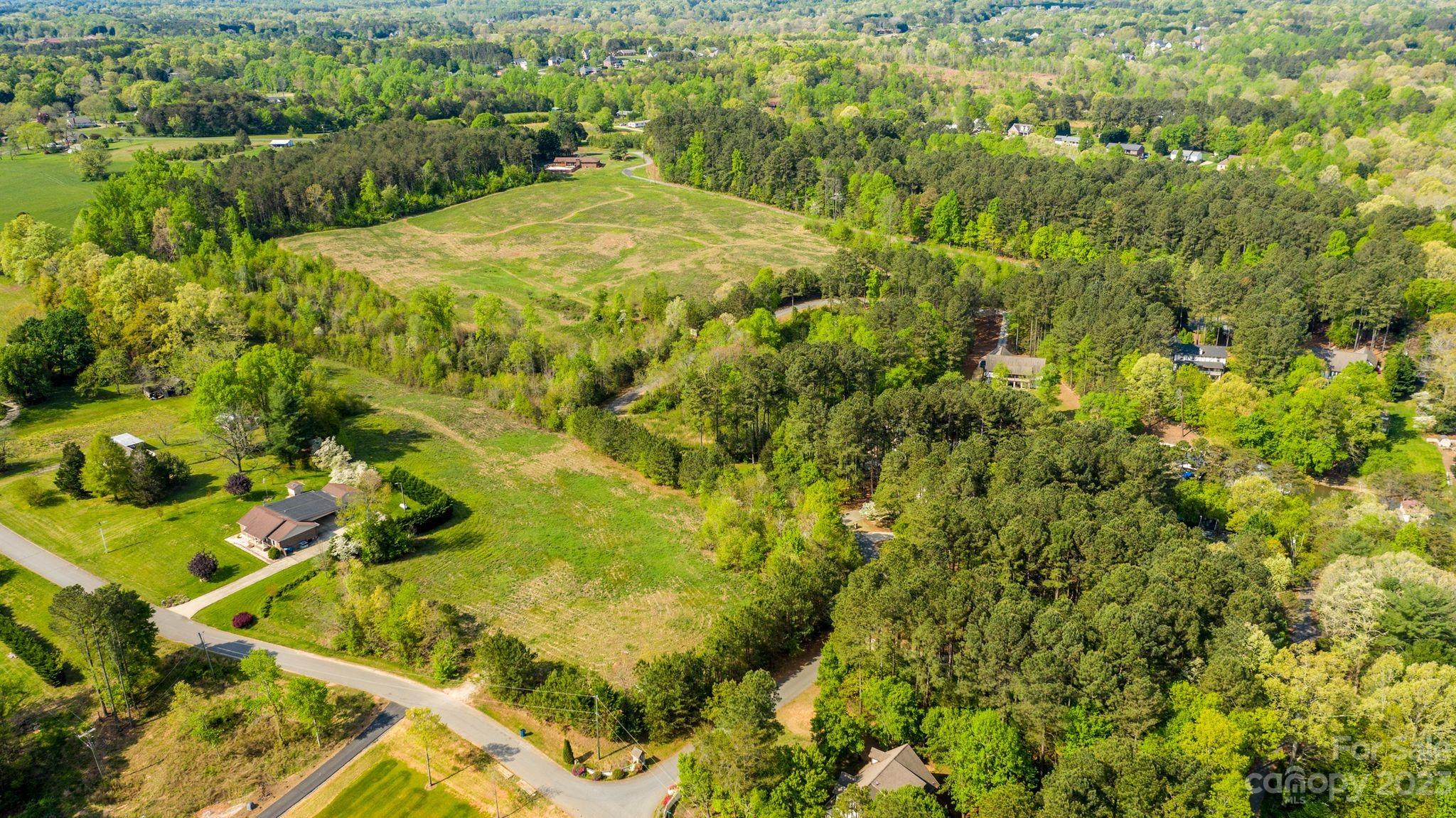 1341 Misty Lane, Unit 9 Hickory, NC 28601 - Photo 5 of 17 a view of a yard with plants