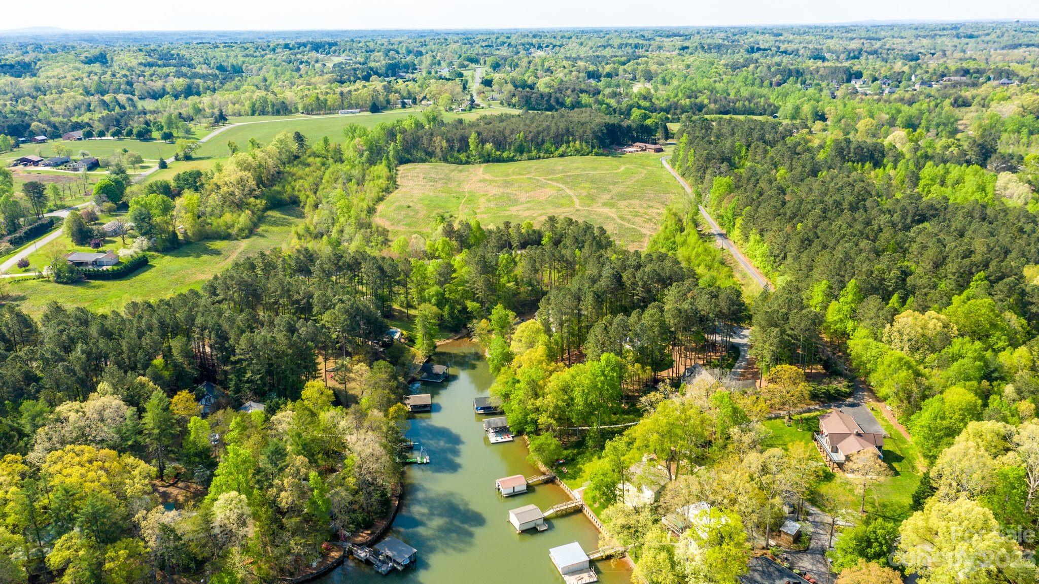 1341 Misty Lane, Unit 9 Hickory, NC 28601 - Photo 7 of 17 a view of a garden with lawn chairs