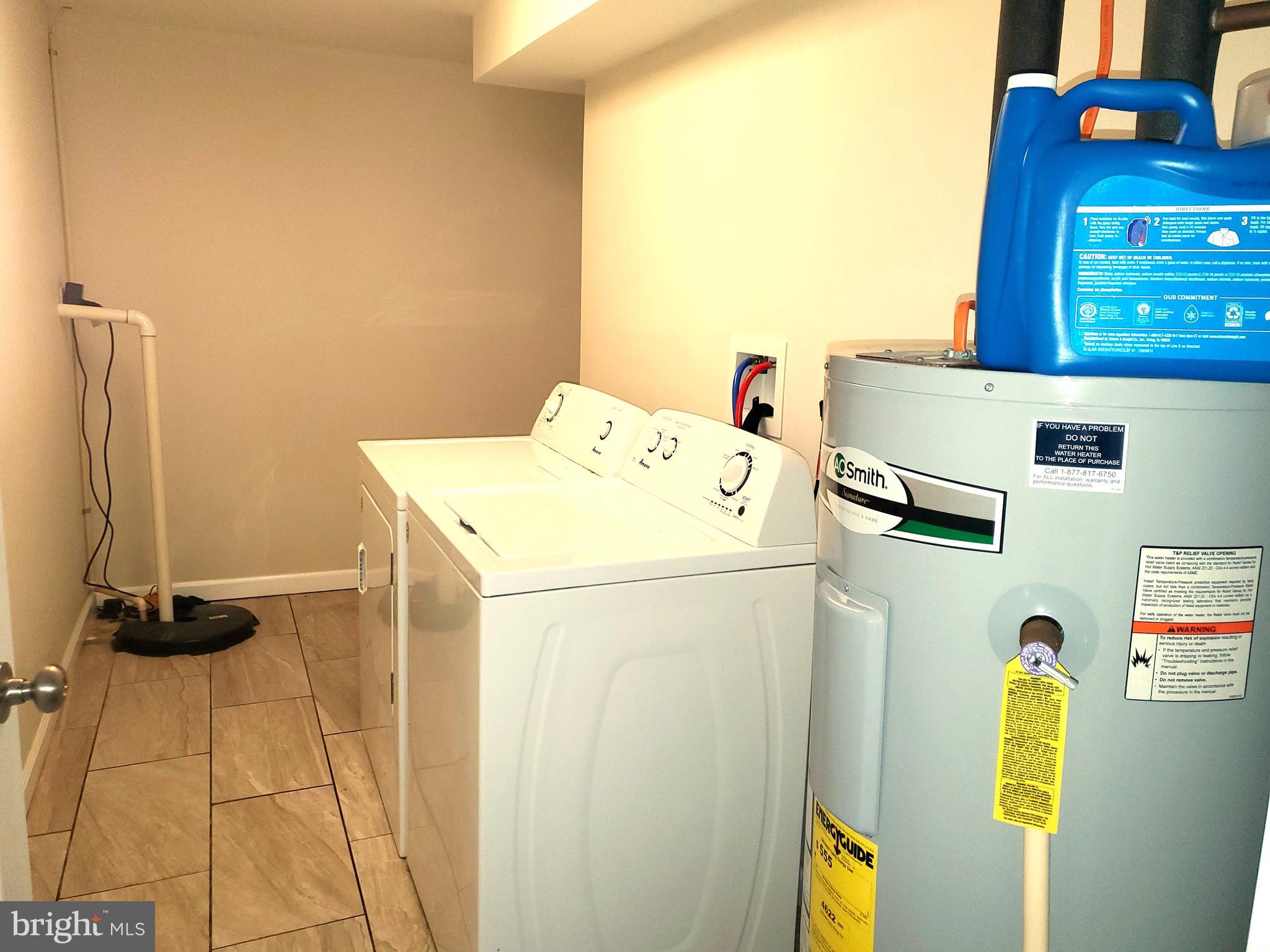 30 Colonial Circle North East, MD 21901 - Photo 14 of 15 a utility room with dryer and washer