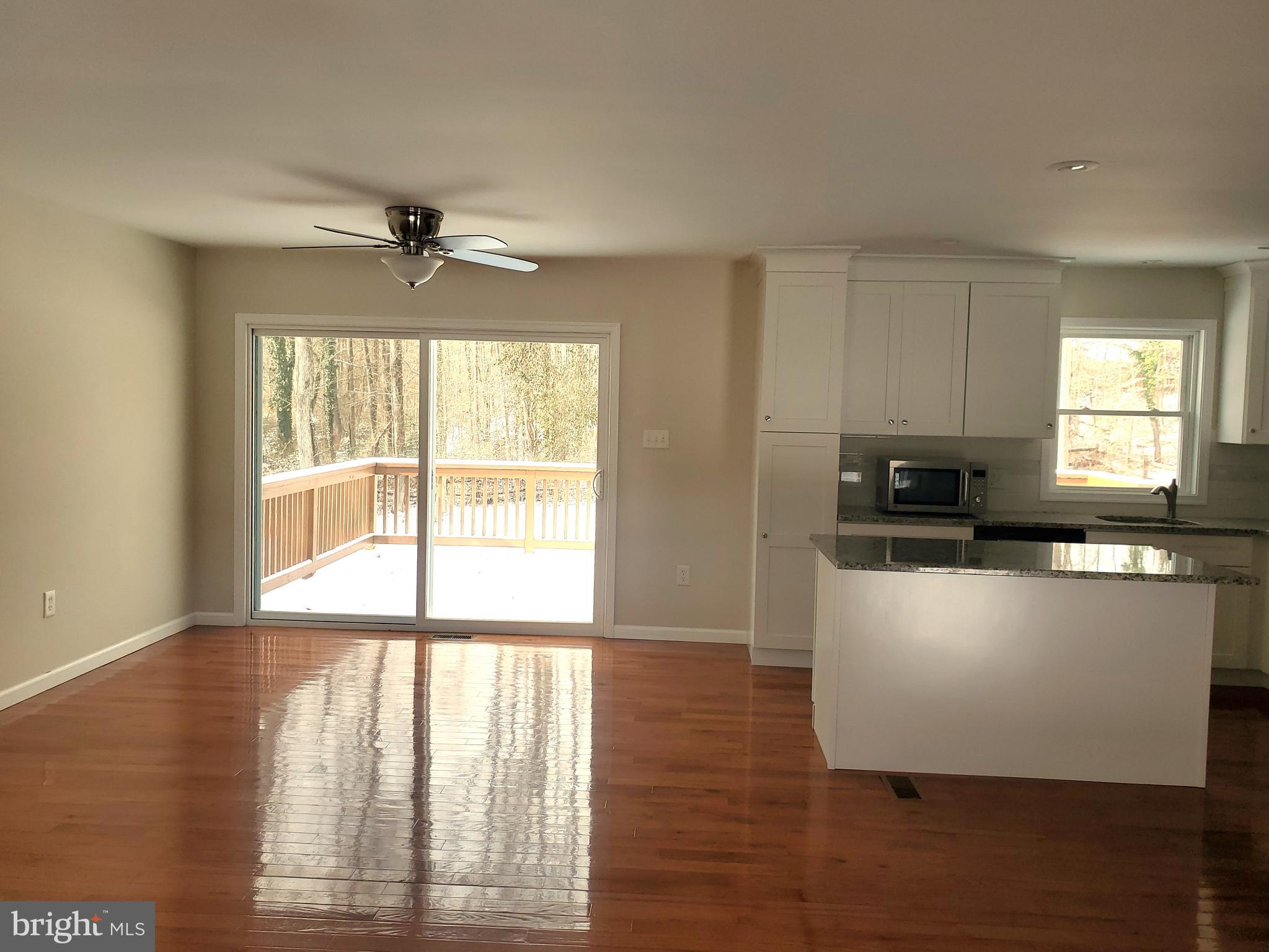30 Colonial Circle North East, MD 21901 - Photo 5 of 15 a kitchen with wooden floors and white walls