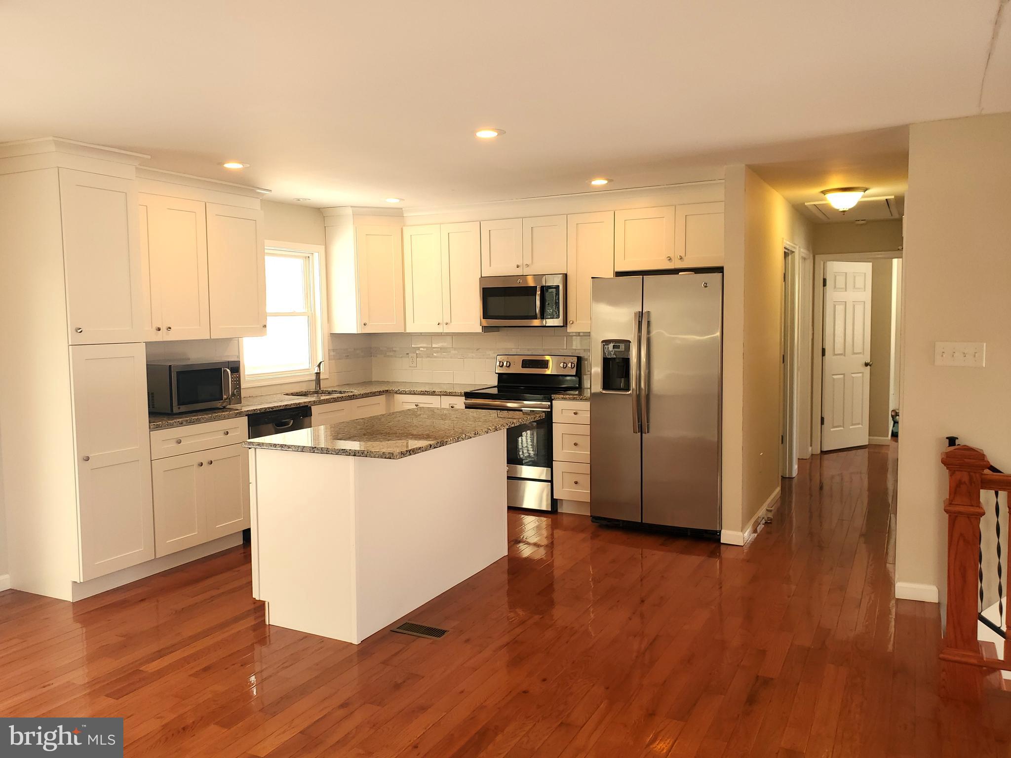 30 Colonial Circle North East, MD 21901 - Photo 6 of 15 a kitchen with stainless steel appliances a refrigerator stove microwave and cabinets