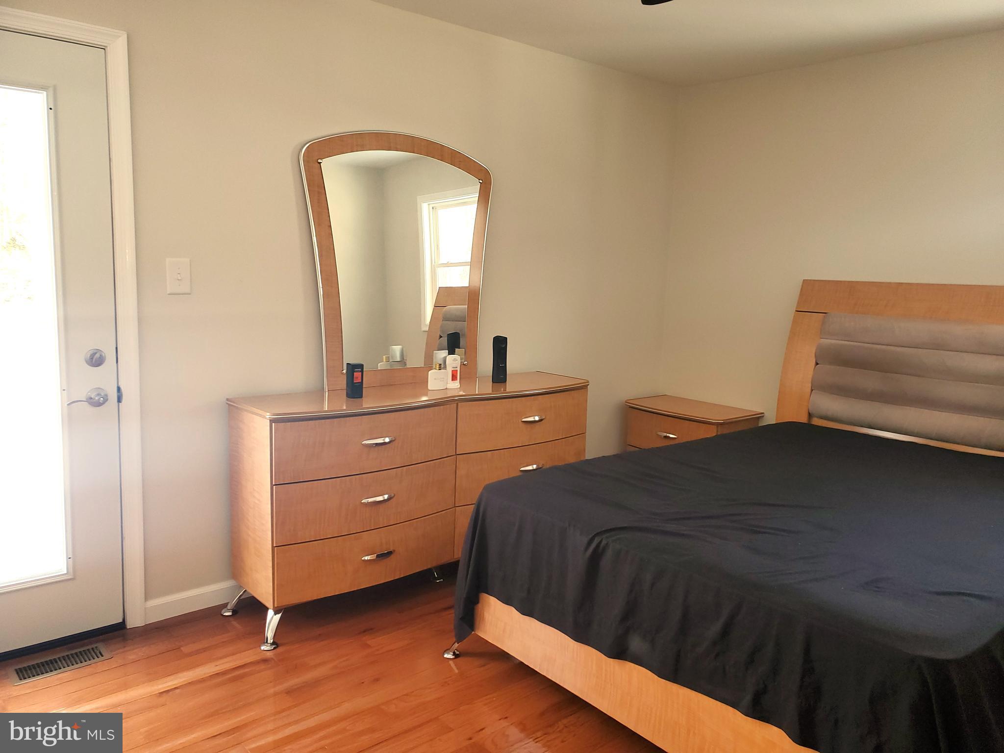 30 Colonial Circle North East, MD 21901 - Photo 8 of 15 a bedroom with a bed and a dresser