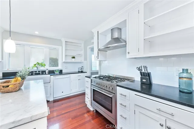 a view of living room with furniture and potted plants