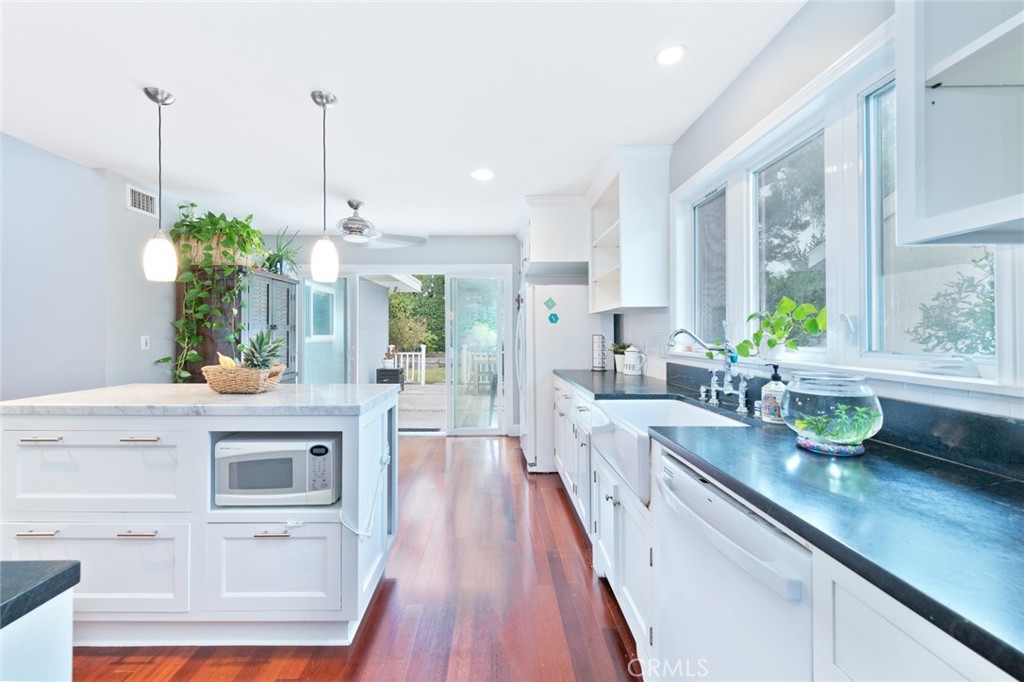 19292 Sierra Perla Road Irvine, CA 92603 - Photo 12 of 21 a view of living room with furniture and potted plants