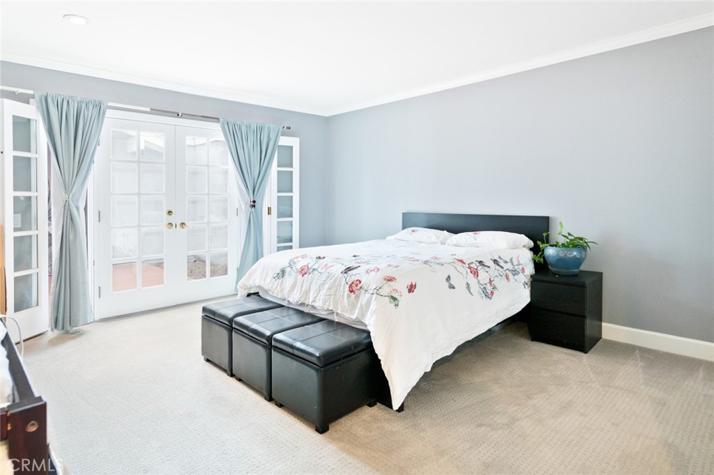 19292 Sierra Perla Road Irvine, CA 92603 - Photo 13 of 21 a bedroom with a bed and a large window