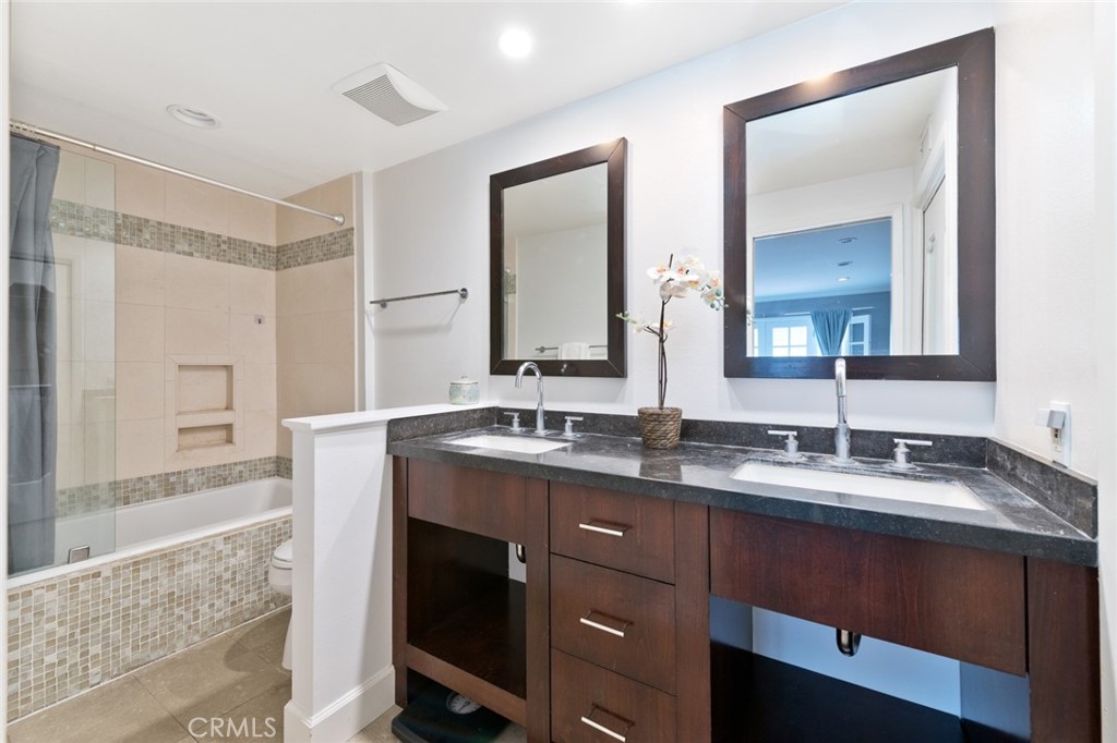 19292 Sierra Perla Road Irvine, CA 92603 - Photo 14 of 21 a bathroom with a granite countertop sink mirror and double