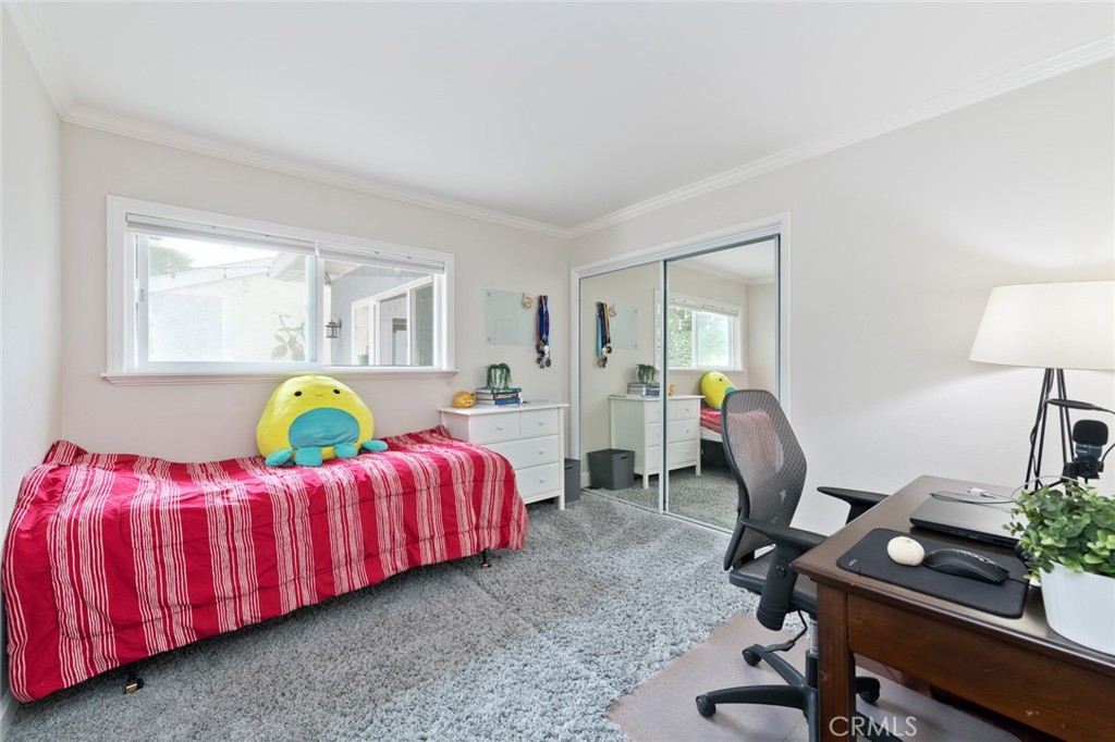 19292 Sierra Perla Road Irvine, CA 92603 - Photo 15 of 21 a bedroom with a bed a desk and chair