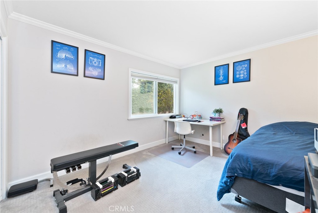 19292 Sierra Perla Road Irvine, CA 92603 - Photo 16 of 21 a bedroom with a bed and a desk