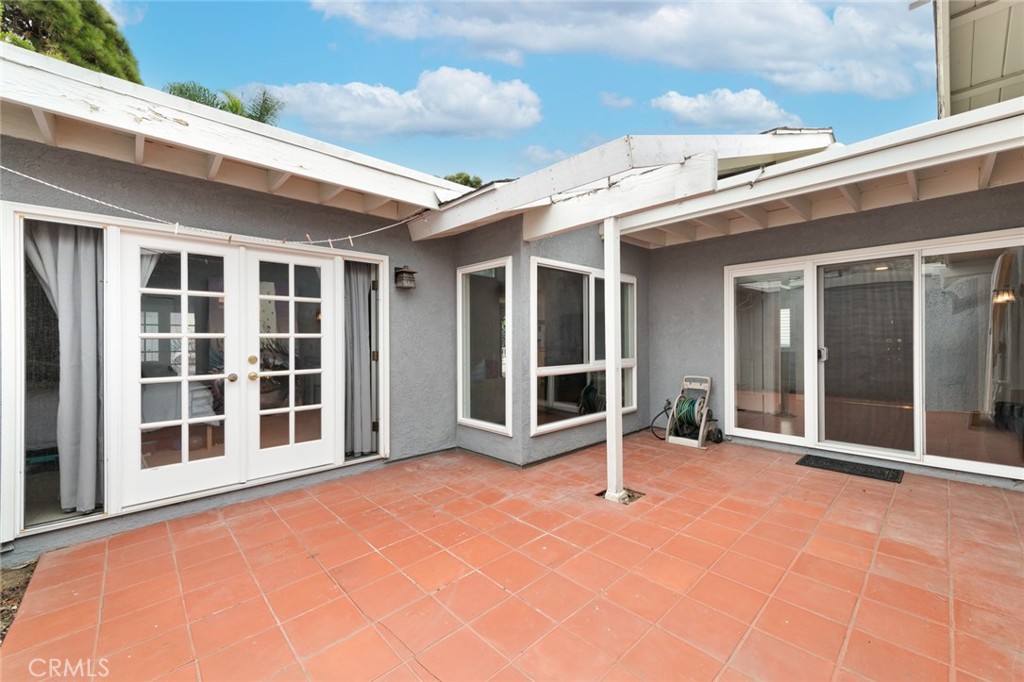 19292 Sierra Perla Road Irvine, CA 92603 - Photo 19 of 21 a view of an outdoor space with porch and windows