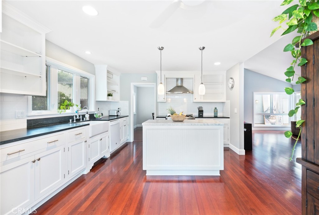 19292 Sierra Perla Road Irvine, CA 92603 - Photo 9 of 21 a kitchen with white cabinets and white appliances