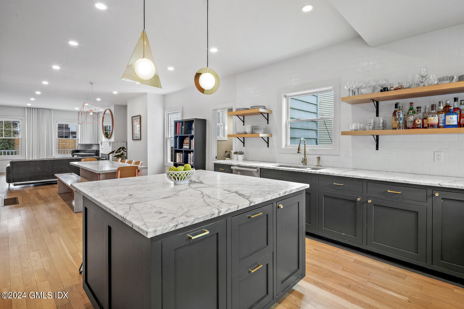 15 Elm Place Greenwich, CT 06830 - Photo 12 of 40 a kitchen with a counter top space appliances and a wooden floor