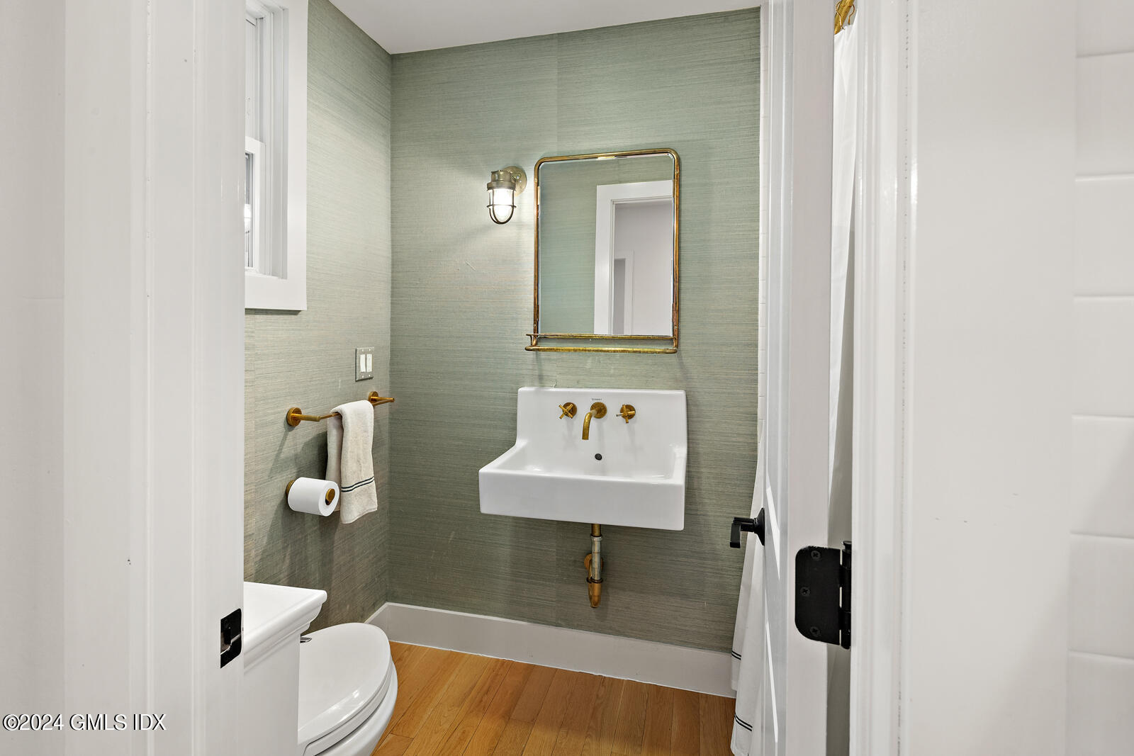 15 Elm Place Greenwich, CT 06830 - Photo 14 of 40 a bathroom with a sink toilet and mirror