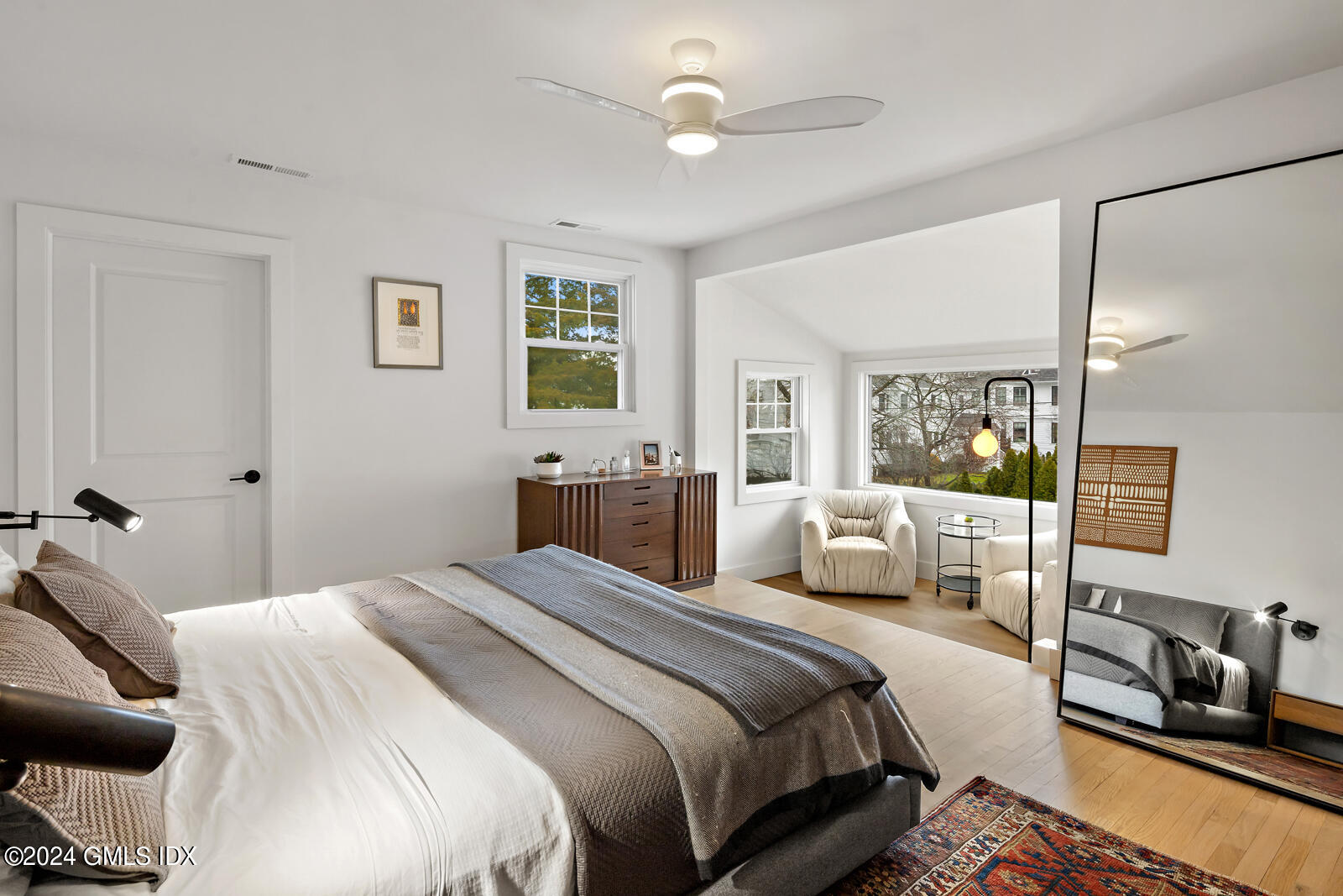 15 Elm Place Greenwich, CT 06830 - Photo 16 of 40 a bedroom with a bed and wooden floor