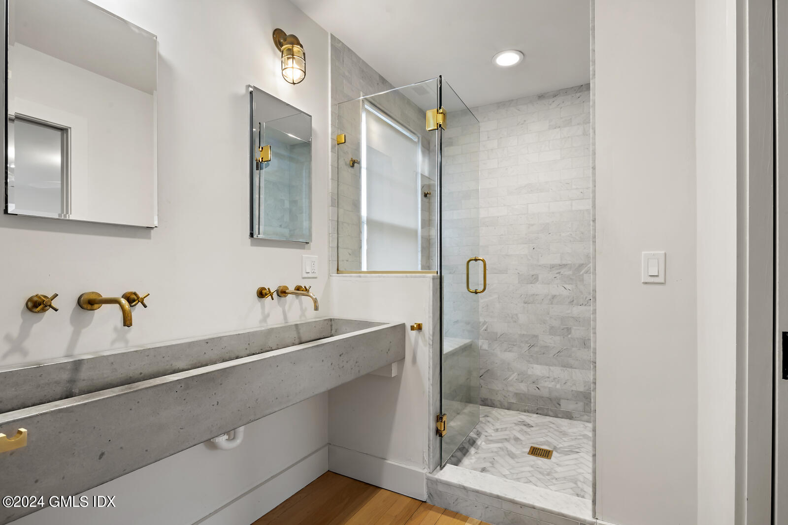 15 Elm Place Greenwich, CT 06830 - Photo 18 of 40 a bathroom with a sink and a mirror