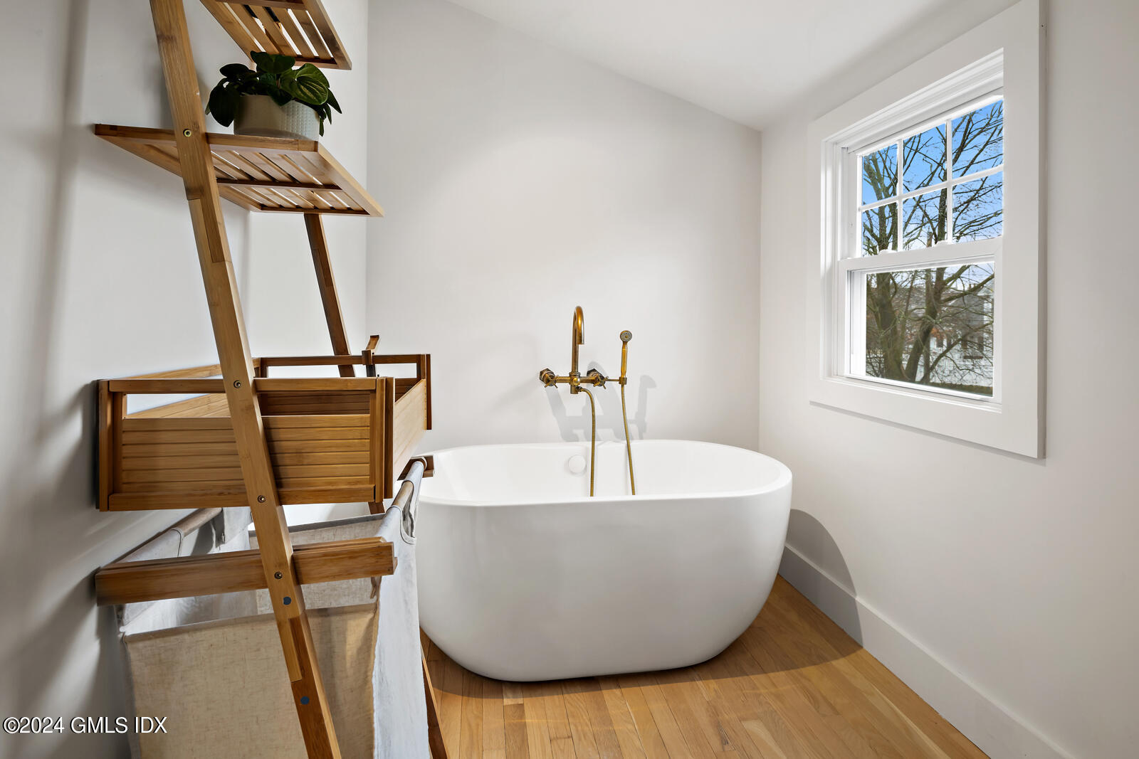 15 Elm Place Greenwich, CT 06830 - Photo 19 of 40 a white bath tub sitting next to a window