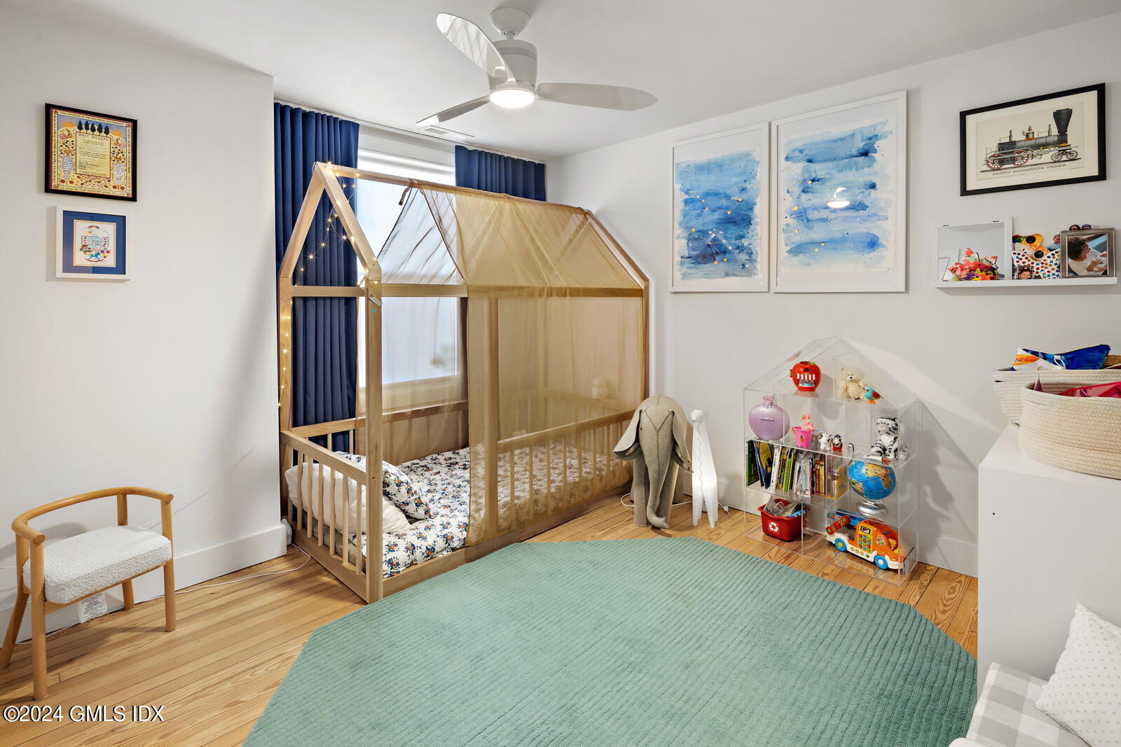 15 Elm Place Greenwich, CT 06830 - Photo 20 of 40 a bedroom with furniture a baby crib and a window