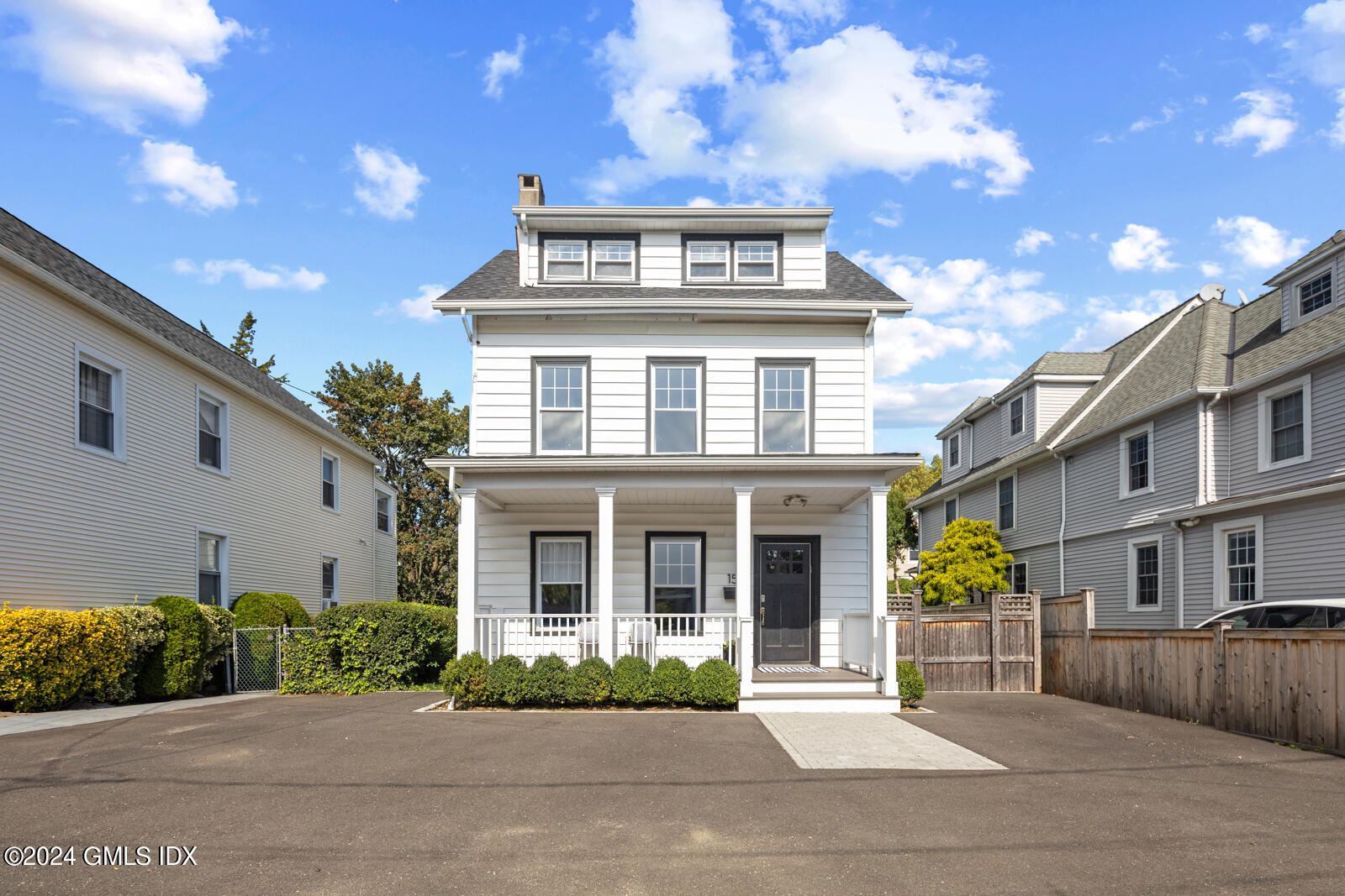 15 Elm Place Greenwich, CT 06830 - Photo 2 of 40 a front view of a house with a garden