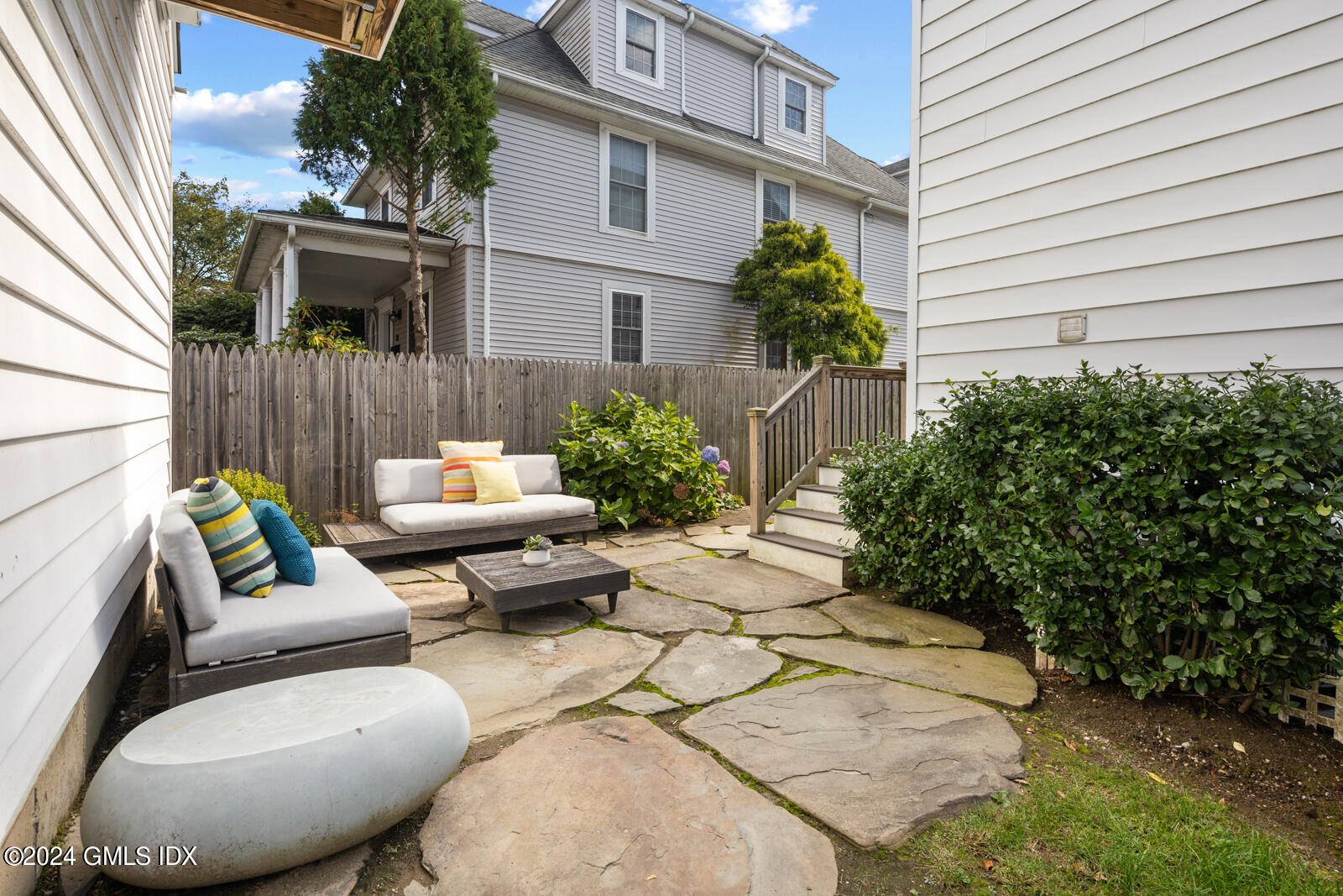 15 Elm Place Greenwich, CT 06830 - Photo 30 of 40 a view of a patio with couches chairs and a potted plant