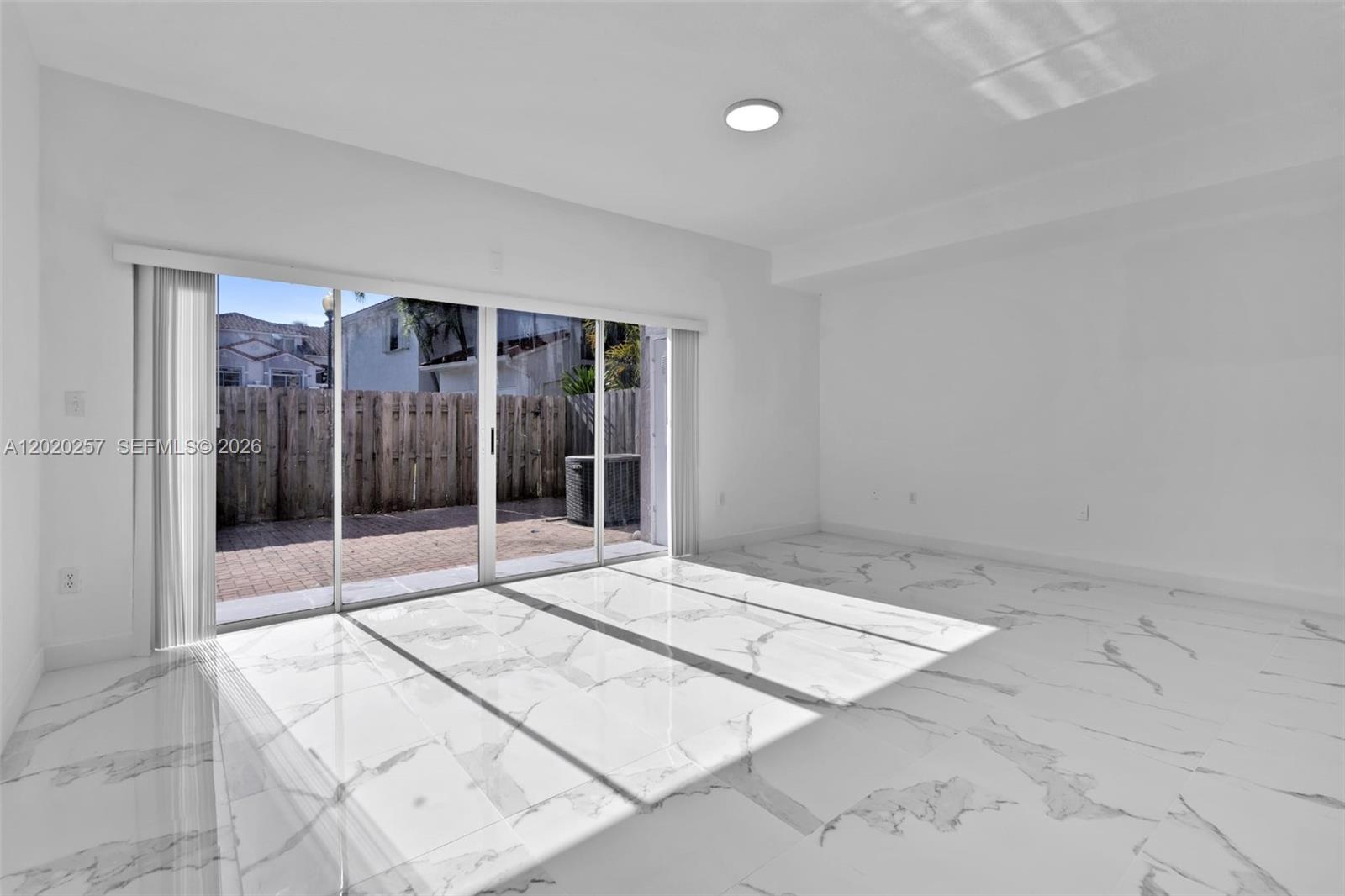 10245 Southwest 154th Place, Unit 1123 Miami, FL 33196 - Photo 20 of 38 a view of an empty room with window
