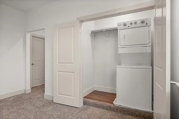 an empty room with a ceiling fan