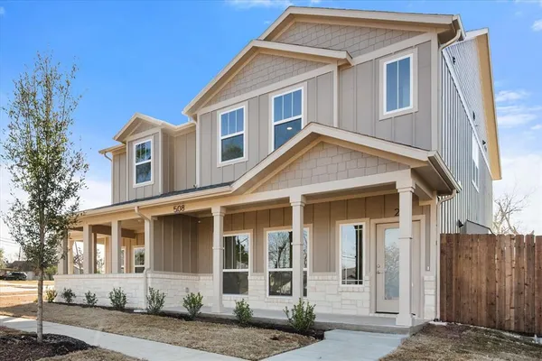 front view of a house with a yard