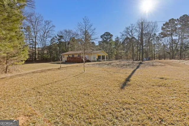 a backyard of house with large trees