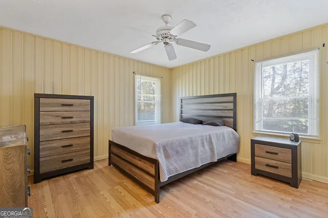 a bedroom with a bed and a dresser