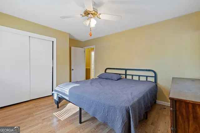 a bedroom with a bed and a table in it