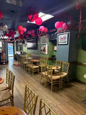 a view of a chairs and tables in a patio