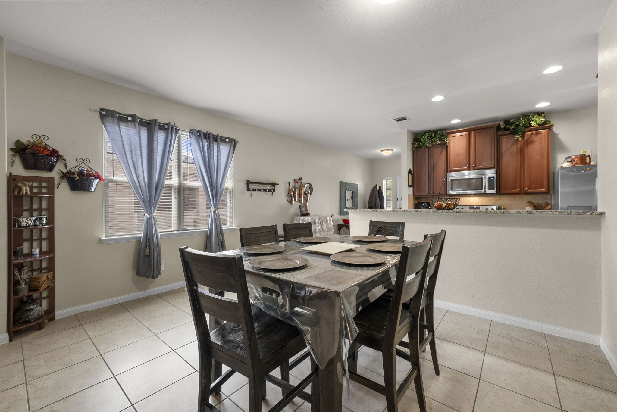 1617 Treeta Trail Kyle, TX 78640 - Photo 18 of 39 Dining area with healthy amount of natural light, light tile patterned floors, and recessed lighting