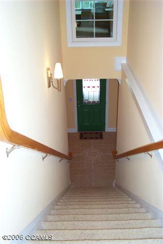 567 Coral Ridge Road Pine Knoll Shores, NC 28512 - Photo 5 of 29 STAIRWELL GOING DOWN