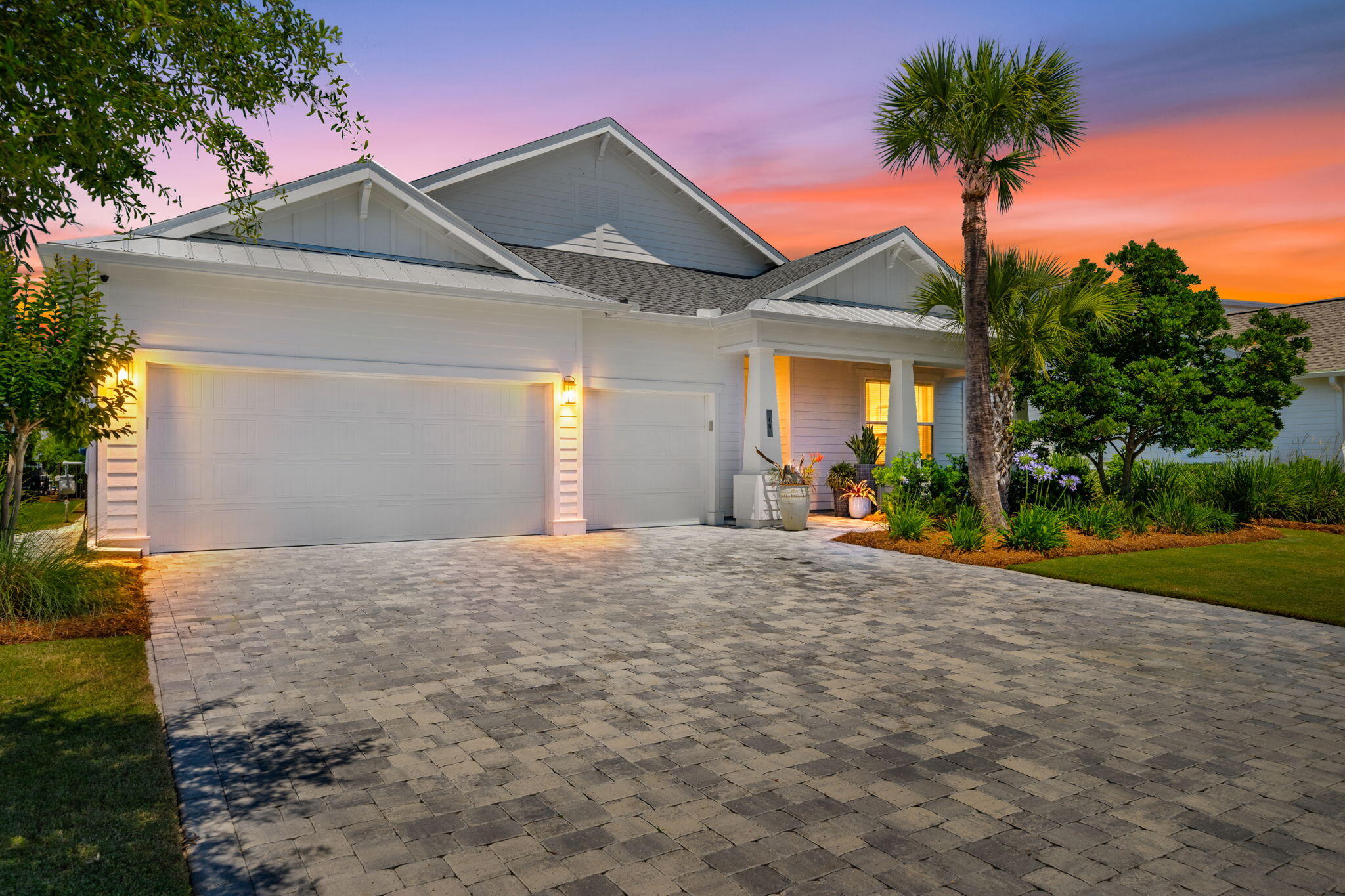 40 Tamoka Ct Inlet Beach Inlet Beach, FL 32461 - Photo 2 of 93 a front view of a house with a yard and garage