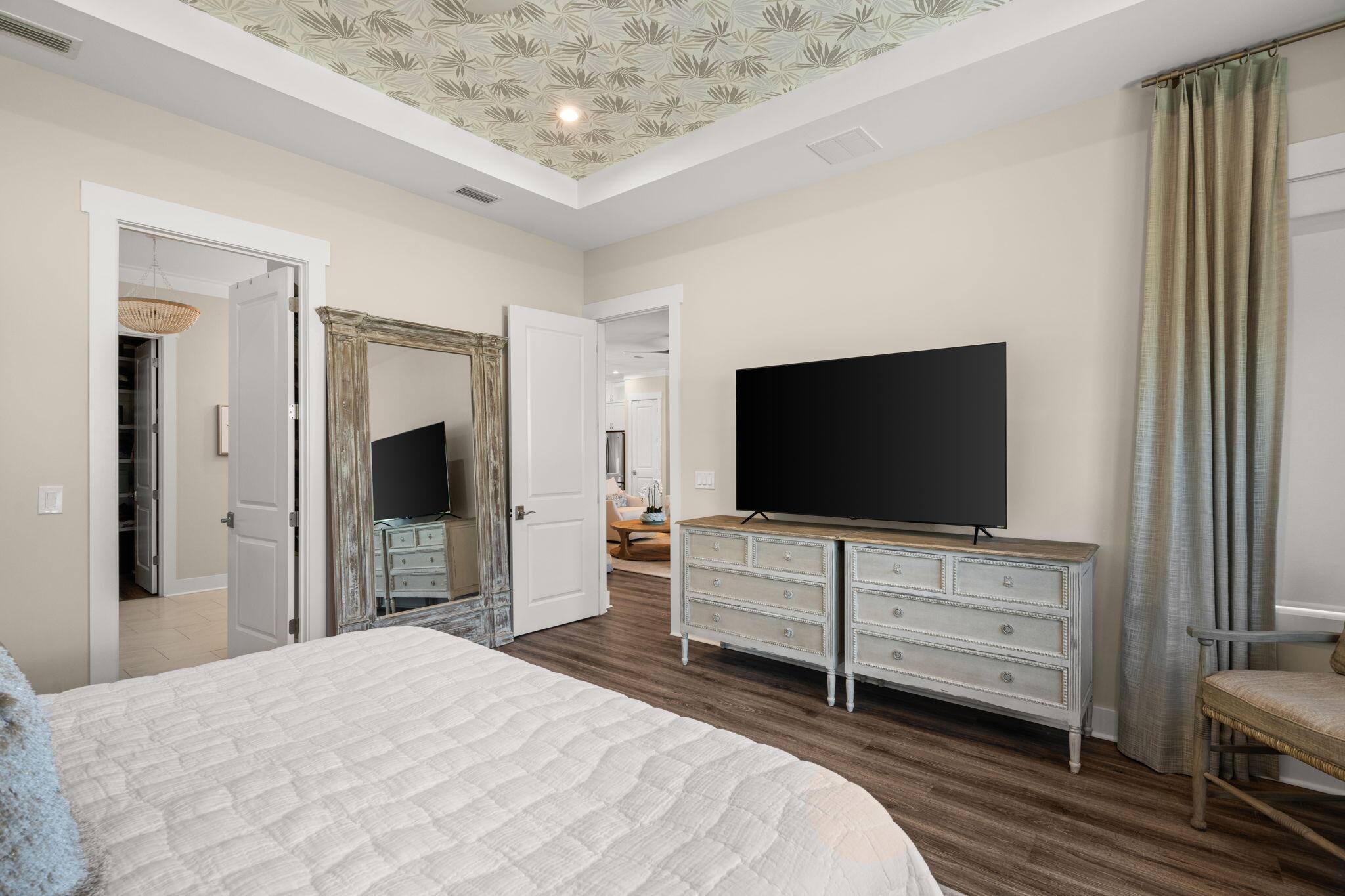 40 Tamoka Ct Inlet Beach Inlet Beach, FL 32461 - Photo 22 of 93 a bedroom with a bed and a flat screen tv in white room