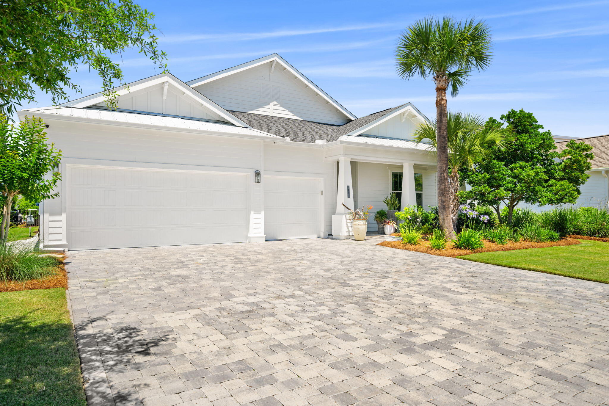 40 Tamoka Ct Inlet Beach Inlet Beach, FL 32461 - Photo 3 of 93 a view of a white house with a yard and potted plants