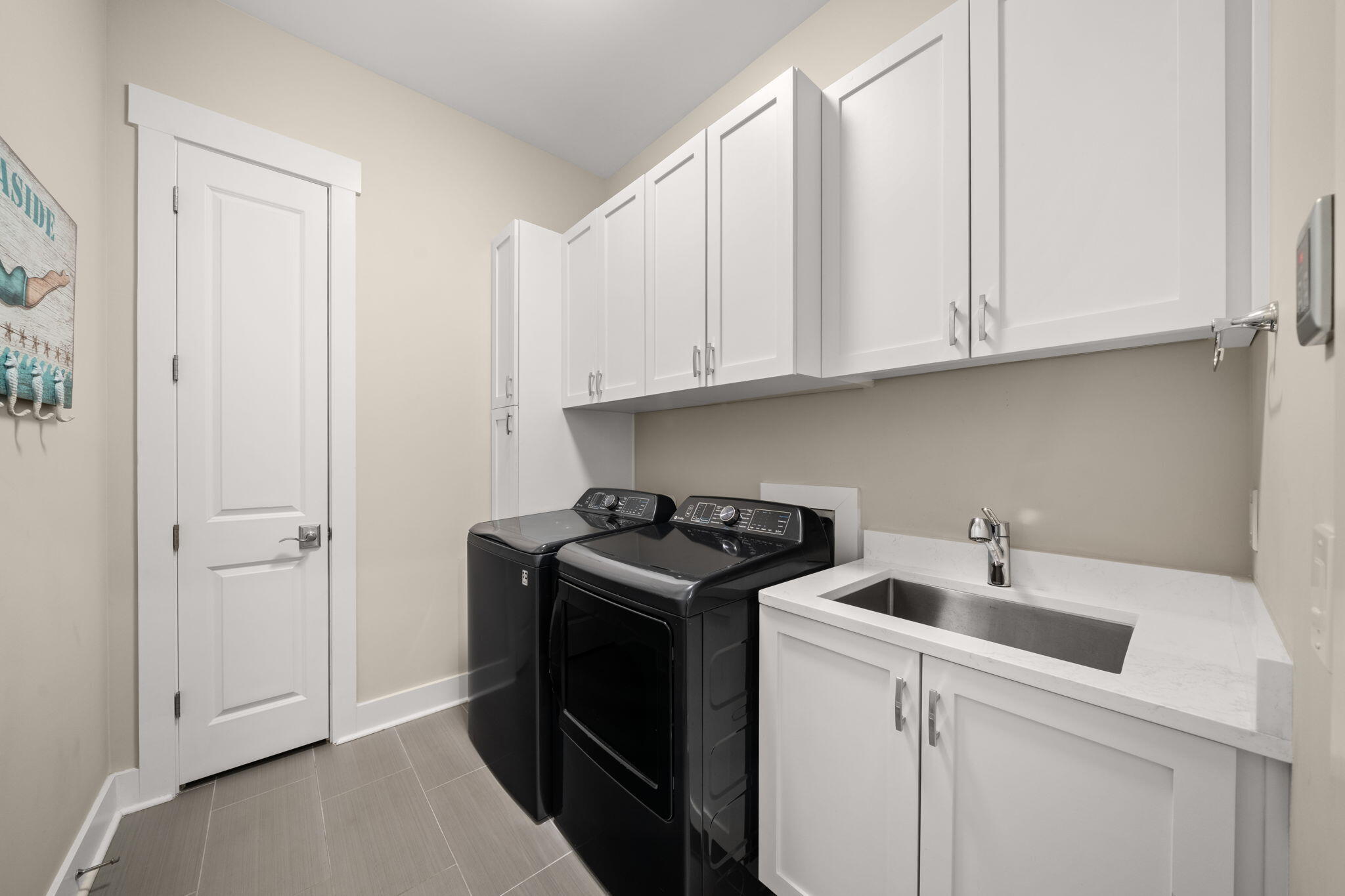 40 Tamoka Ct Inlet Beach Inlet Beach, FL 32461 - Photo 32 of 93 a kitchen with a sink and cabinets