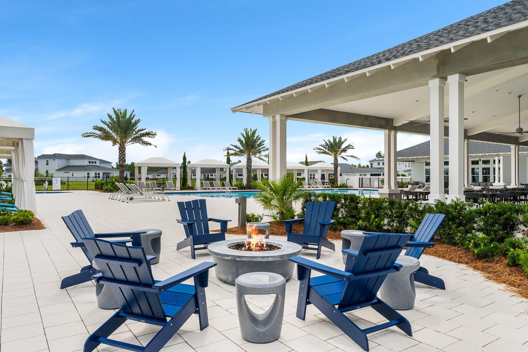 40 Tamoka Ct Inlet Beach Inlet Beach, FL 32461 - Photo 78 of 93 a view of a patio with couches table and chairs potted plants and palm tree